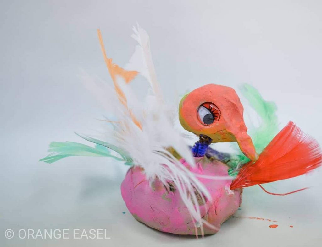 Colorful Clay Pigeon with Feathers and Googly Eyes